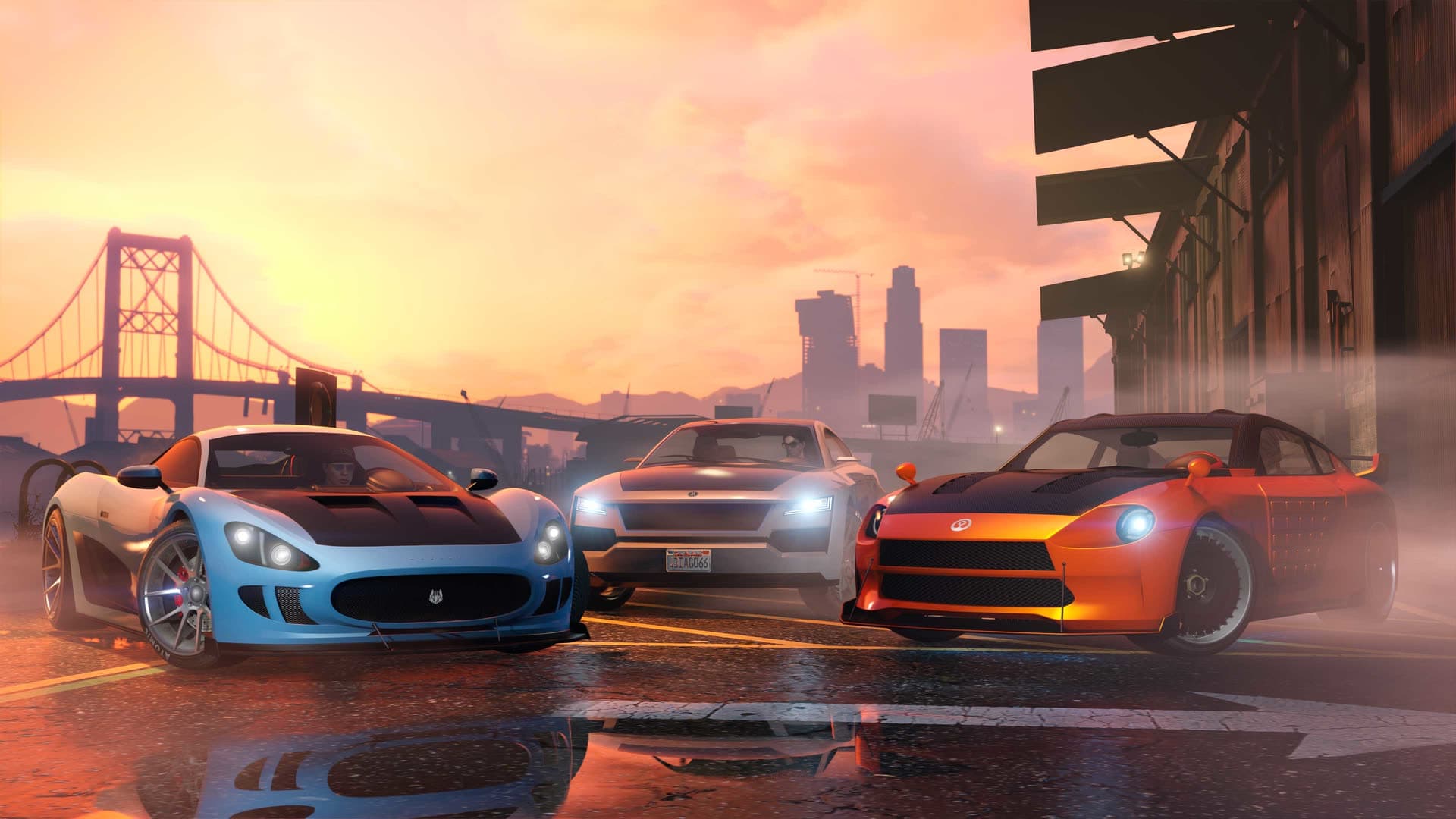 Three sports cars at sunset